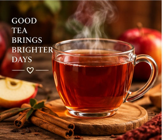 Steaming cup of Blue Cup Apple Cider Rooibos Tea with apples and cinnamon