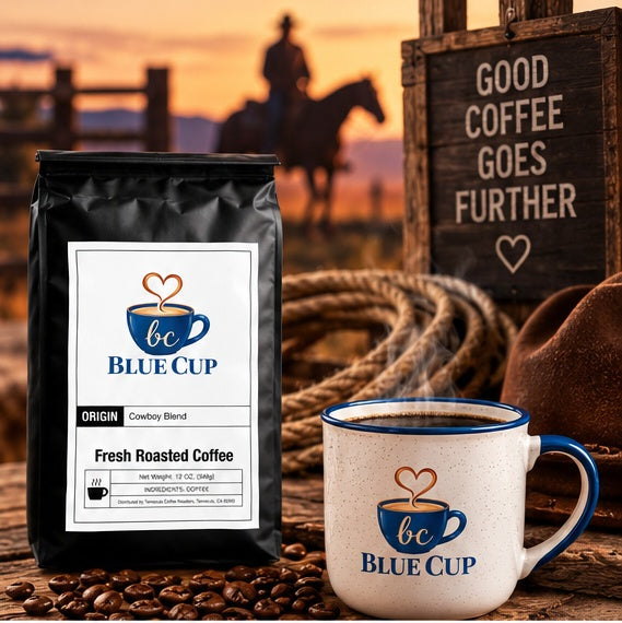 Blue Cup Cowboy Blend coffee bag with steaming branded mug in a warm western-inspired setting