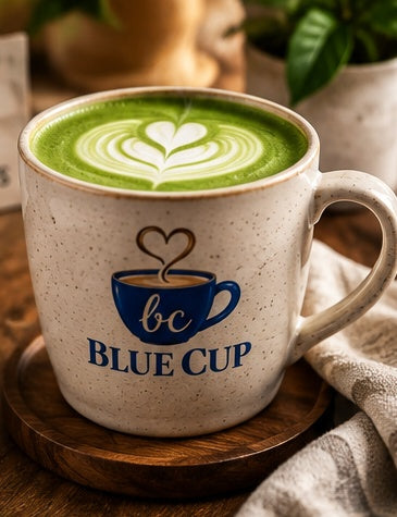 Hot Blue Cup matcha drink in a branded mug